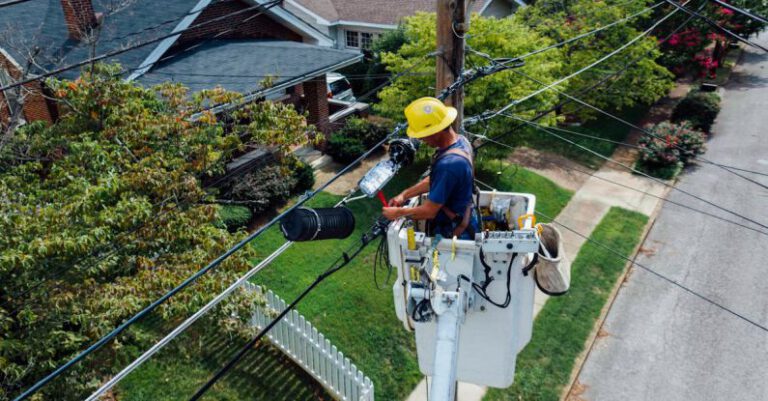 Utilities - Photography of Man Repairing Electrical Wires