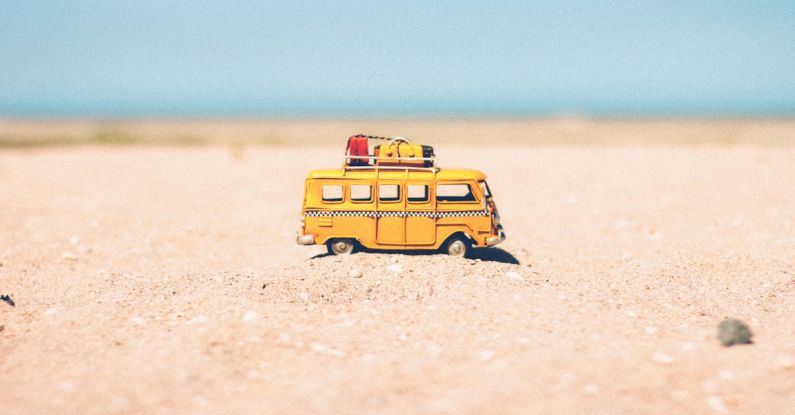 Holiday - Yellow Die-cast Miniature Van on Brown Sand