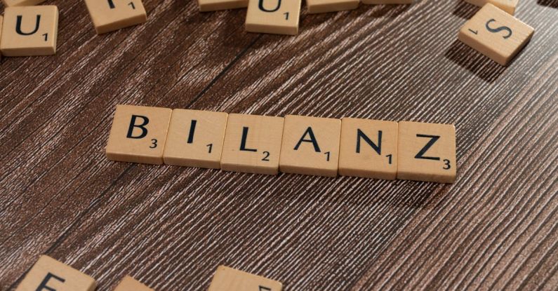 Consolidation - The word blanzn is spelled out in scrabble letters