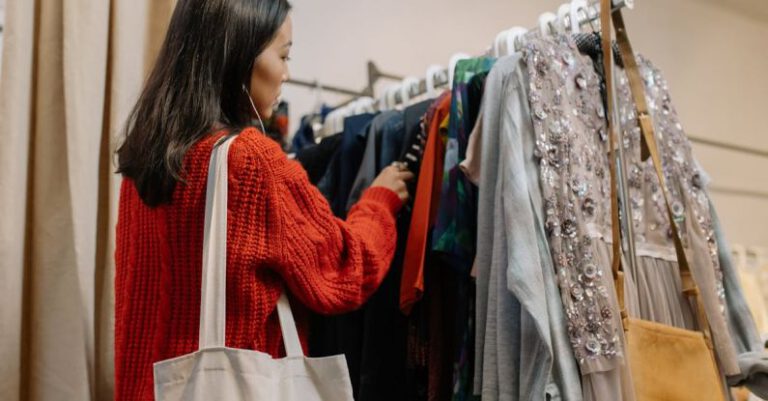 Thrifting - A Woman Shopping for Clothes in a Thrift Store